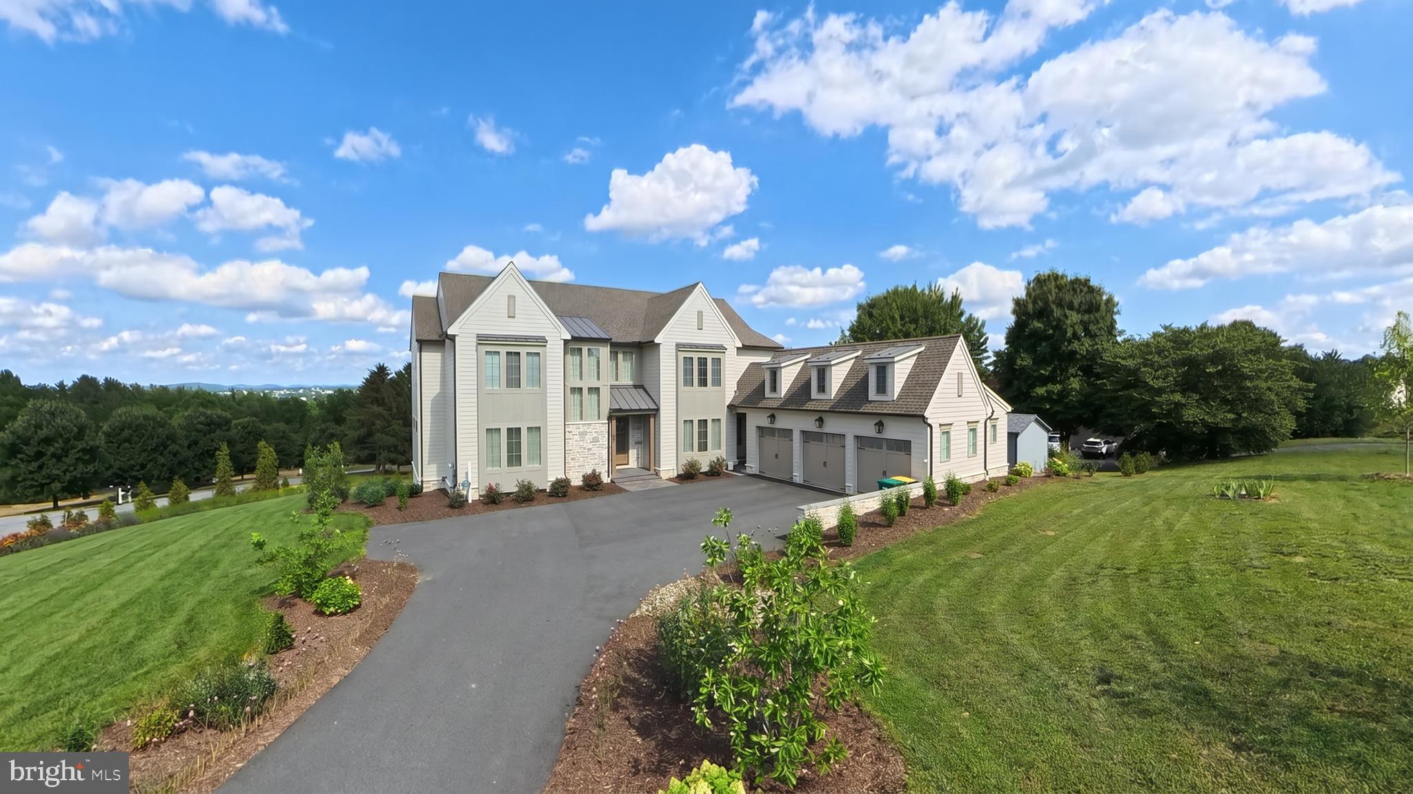 1 Strawberry Lane Lititz, PA 17543 - Photo 3 of 70 a view of a white house with a big yard plants and large trees