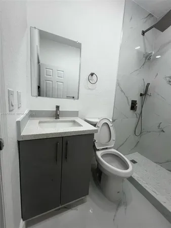 a bathroom with a bathtub and shower