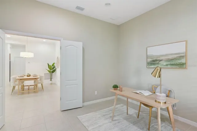 a spacious bathroom with a double vanity sink and a mirror