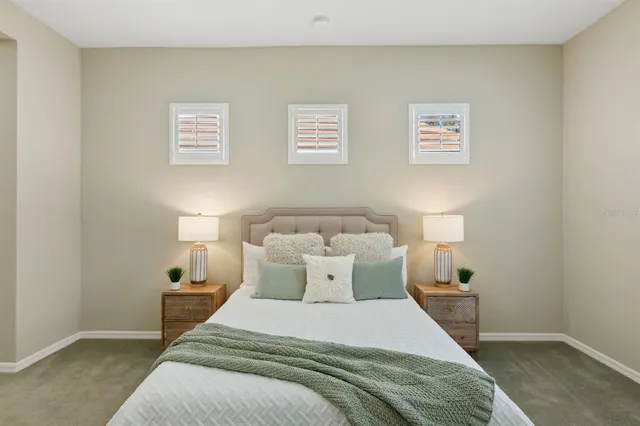 a bathroom with a granite countertop sink mirror and a toilet