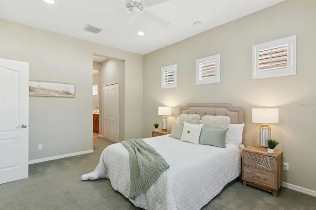 a spacious bathroom with a sink and a mirror