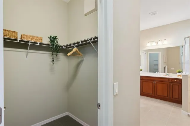 a view of a balcony with chairs and wooden floor