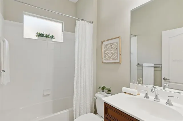 an aerial view of lake residential houses with outdoor space and swimming pool