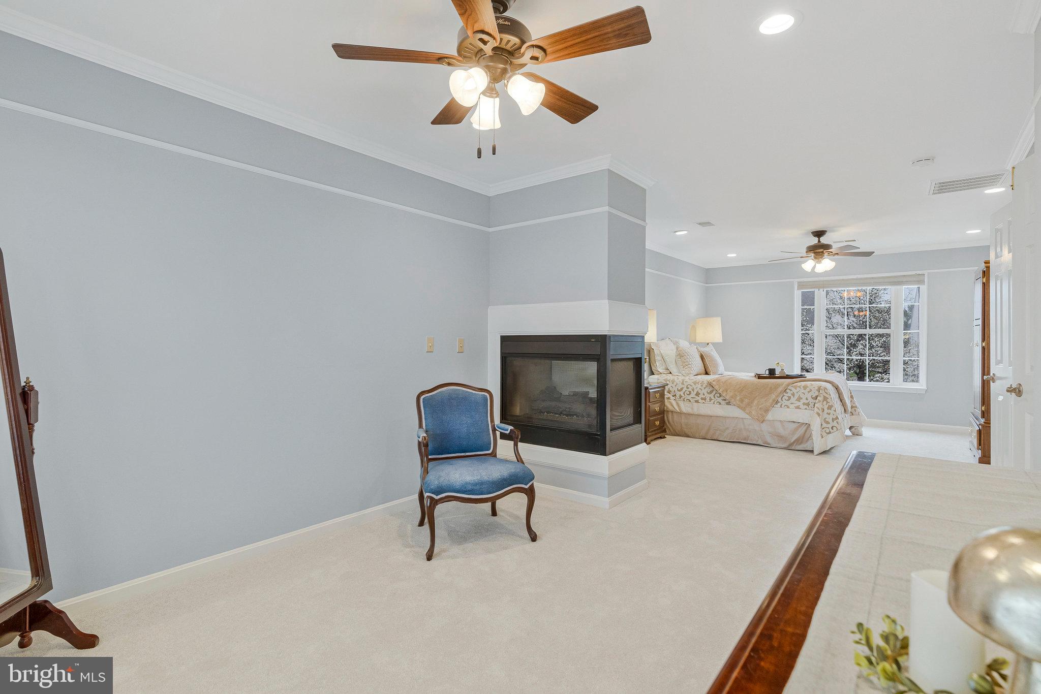 21272 Rosetta Place Ashburn, VA 20147 - Photo 28 of 58 a living room with furniture and a fireplace