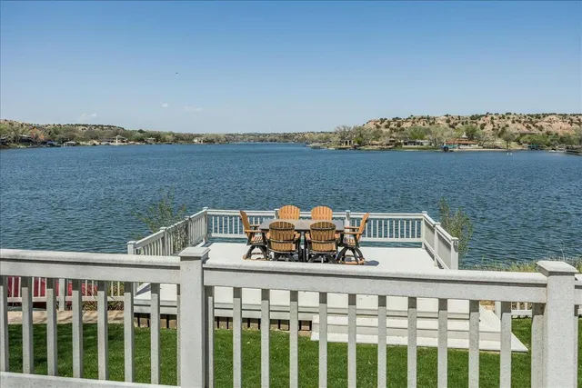 a aerial view of a house with a garden and lake view