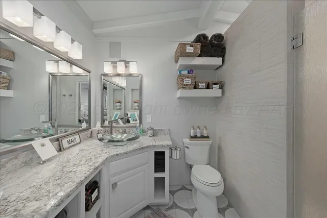 a bedroom with a bed a couch and a window