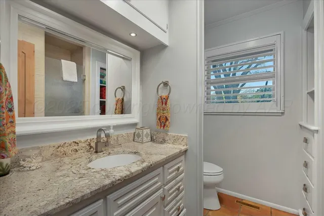 a living room with furniture a dining table and kitchen view