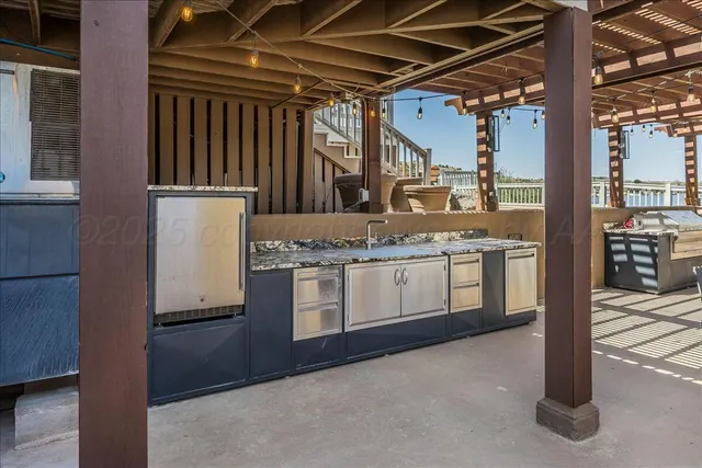 a balcony with table and chairs