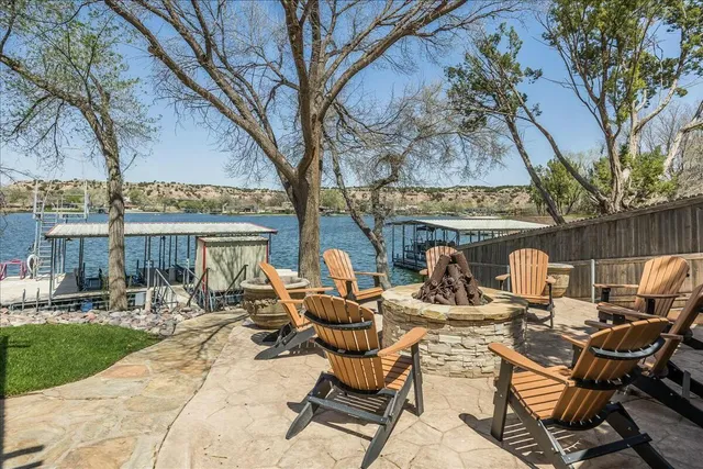 a view of swimming pool with seating area