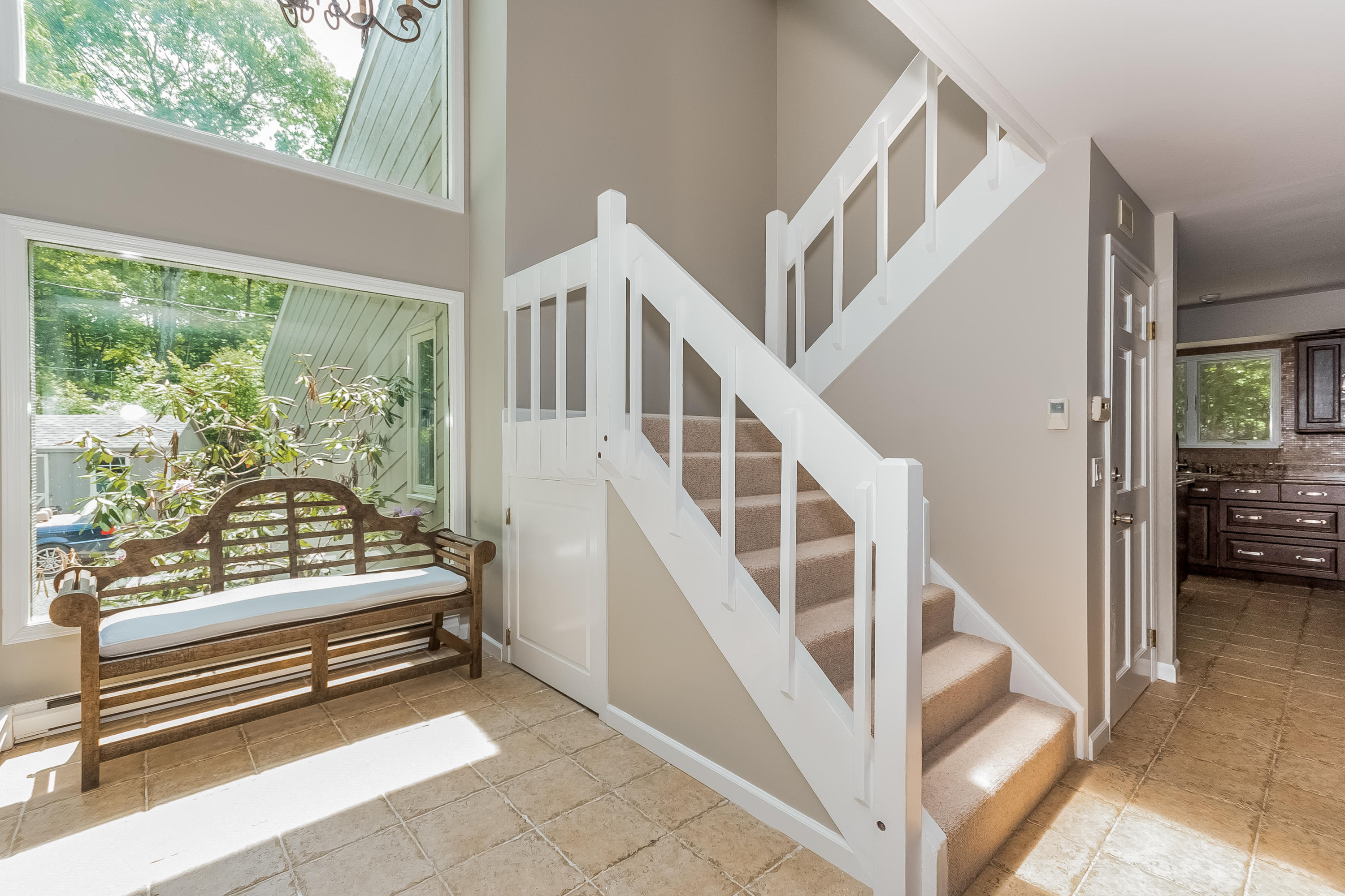 17 Bayberry Hill Road Ridgefield, CT 06877 - Photo 11 of 50 a view of staircase with lots of stuff and furniture