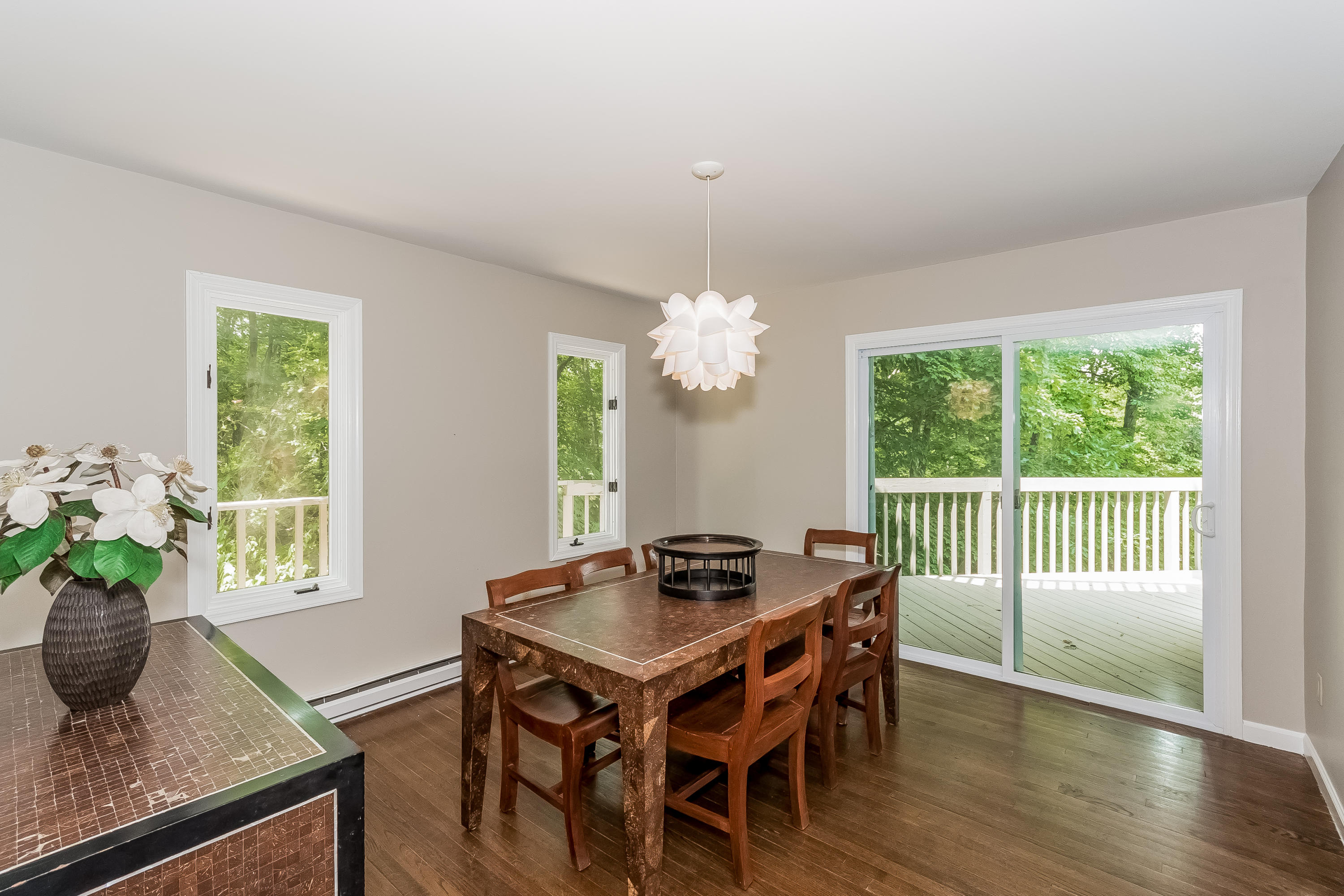 17 Bayberry Hill Road Ridgefield, CT 06877 - Photo 15 of 50 a dining room with furniture a chandelier and wooden floor