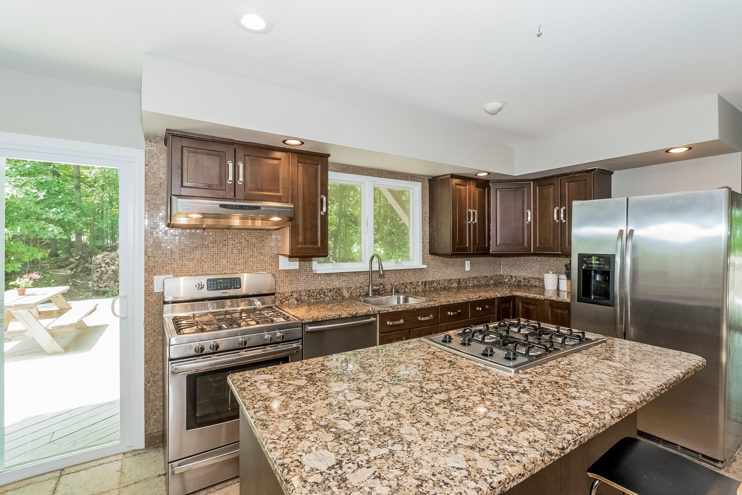 17 Bayberry Hill Road Ridgefield, CT 06877 - Photo 19 of 50 a kitchen with a stove a sink and a refrigerator