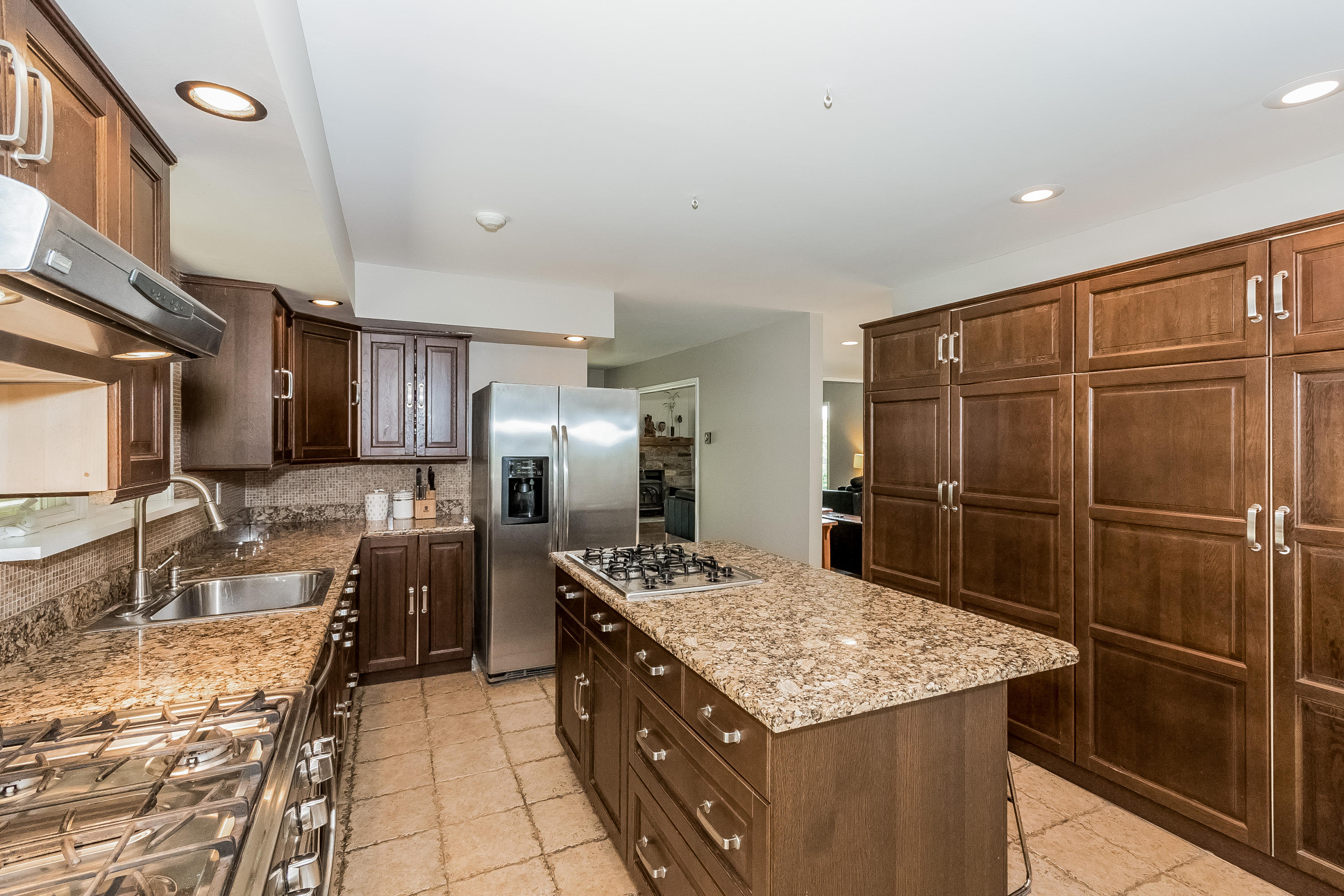 17 Bayberry Hill Road Ridgefield, CT 06877 - Photo 20 of 50 a kitchen with granite countertop a sink stainless steel appliances and counter space