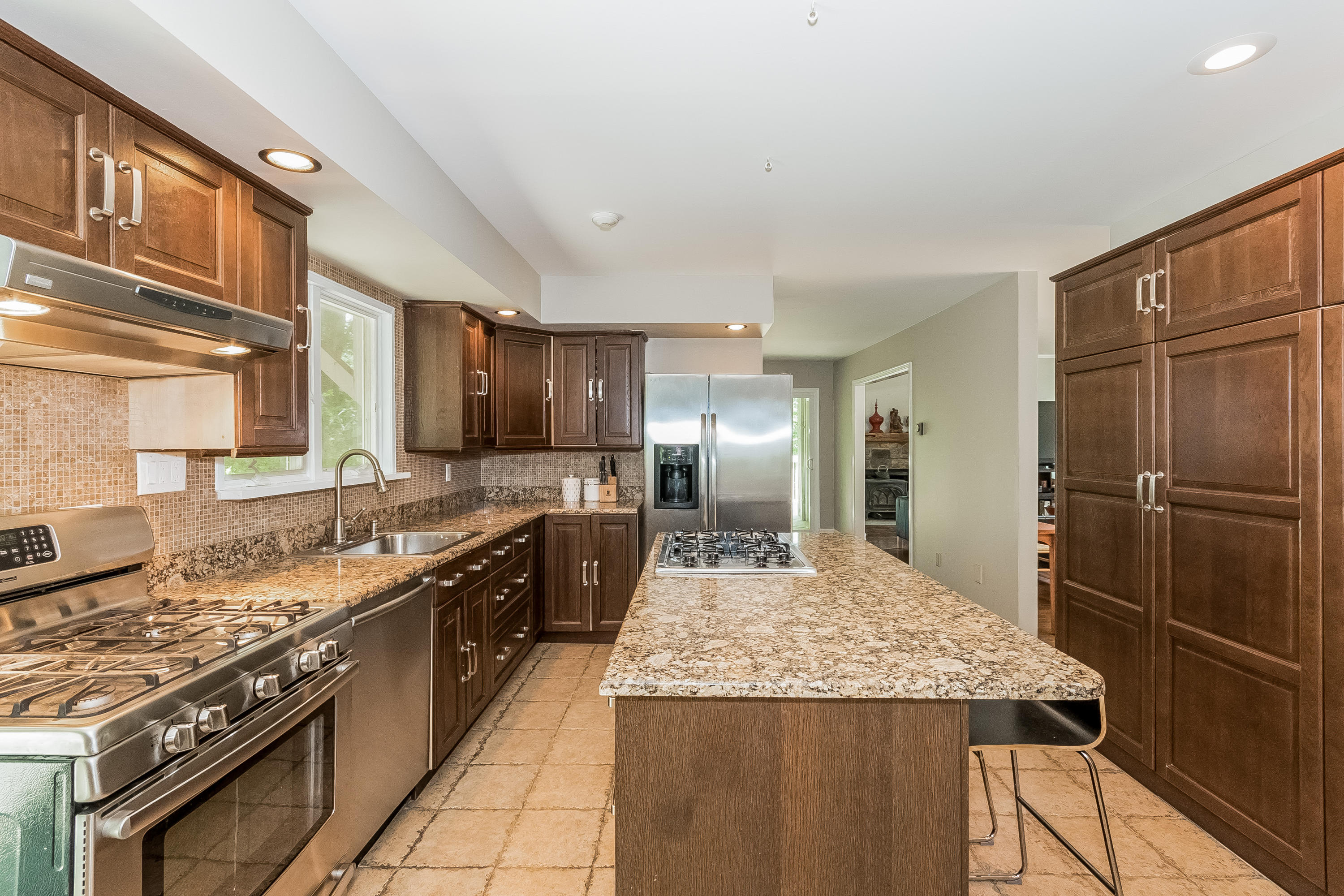 17 Bayberry Hill Road Ridgefield, CT 06877 - Photo 21 of 50 a large kitchen with stainless steel appliances granite countertop a stove refrigerator and a sink