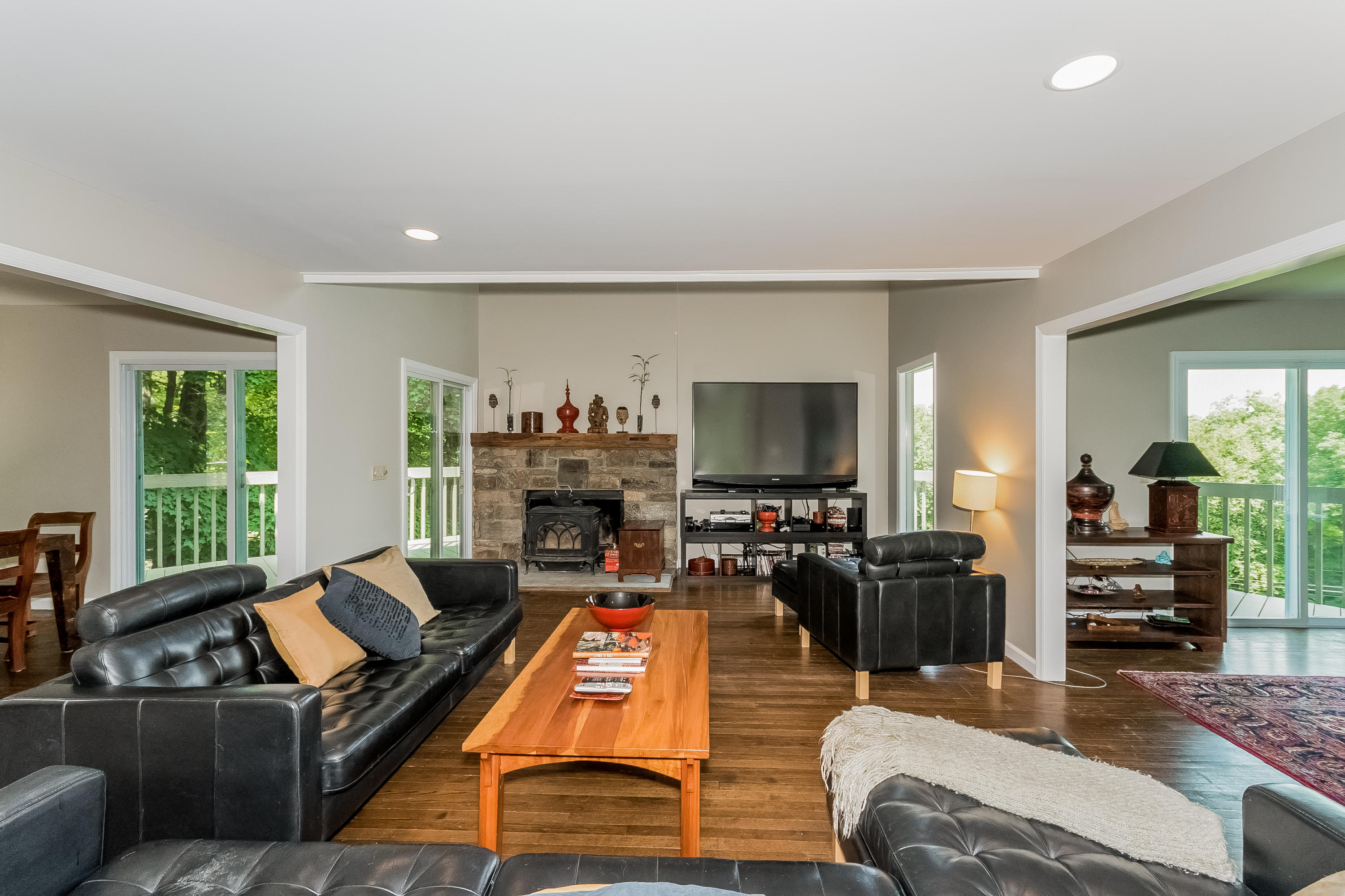 17 Bayberry Hill Road Ridgefield, CT 06877 - Photo 24 of 50 a living room with furniture flat screen tv and a large window