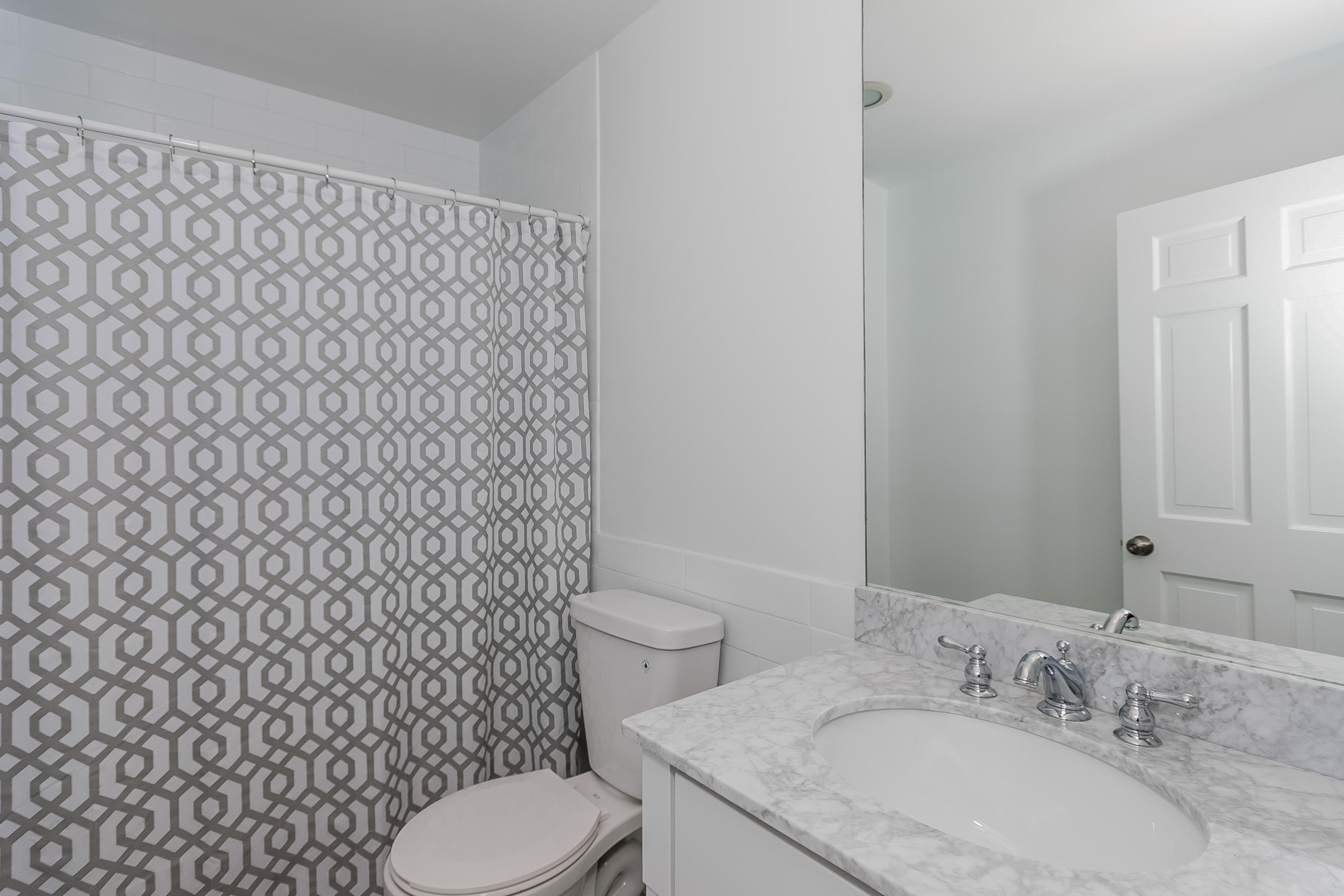 17 Bayberry Hill Road Ridgefield, CT 06877 - Photo 34 of 50 a bathroom with a granite countertop toilet and a sink