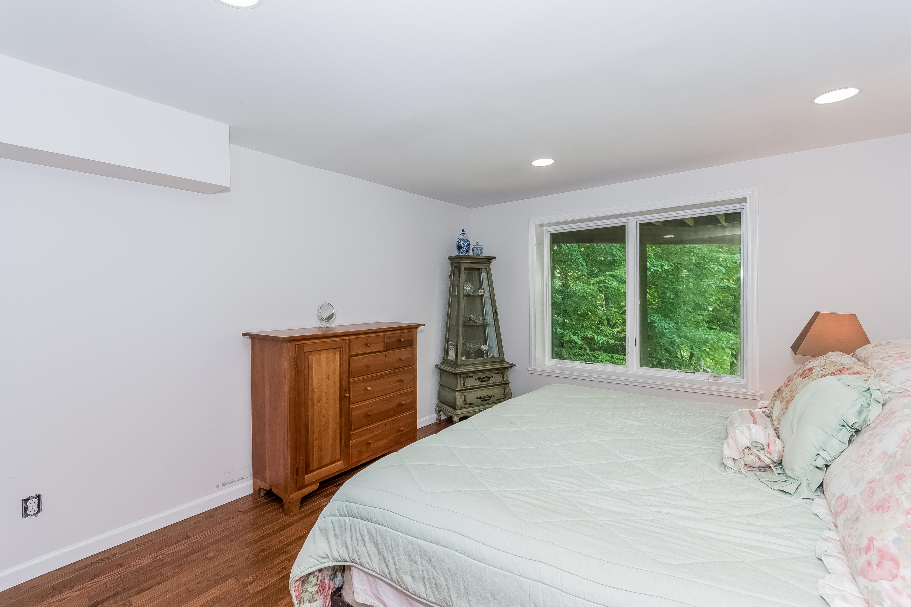 17 Bayberry Hill Road Ridgefield, CT 06877 - Photo 39 of 50 a bedroom with a bed and wooden floor