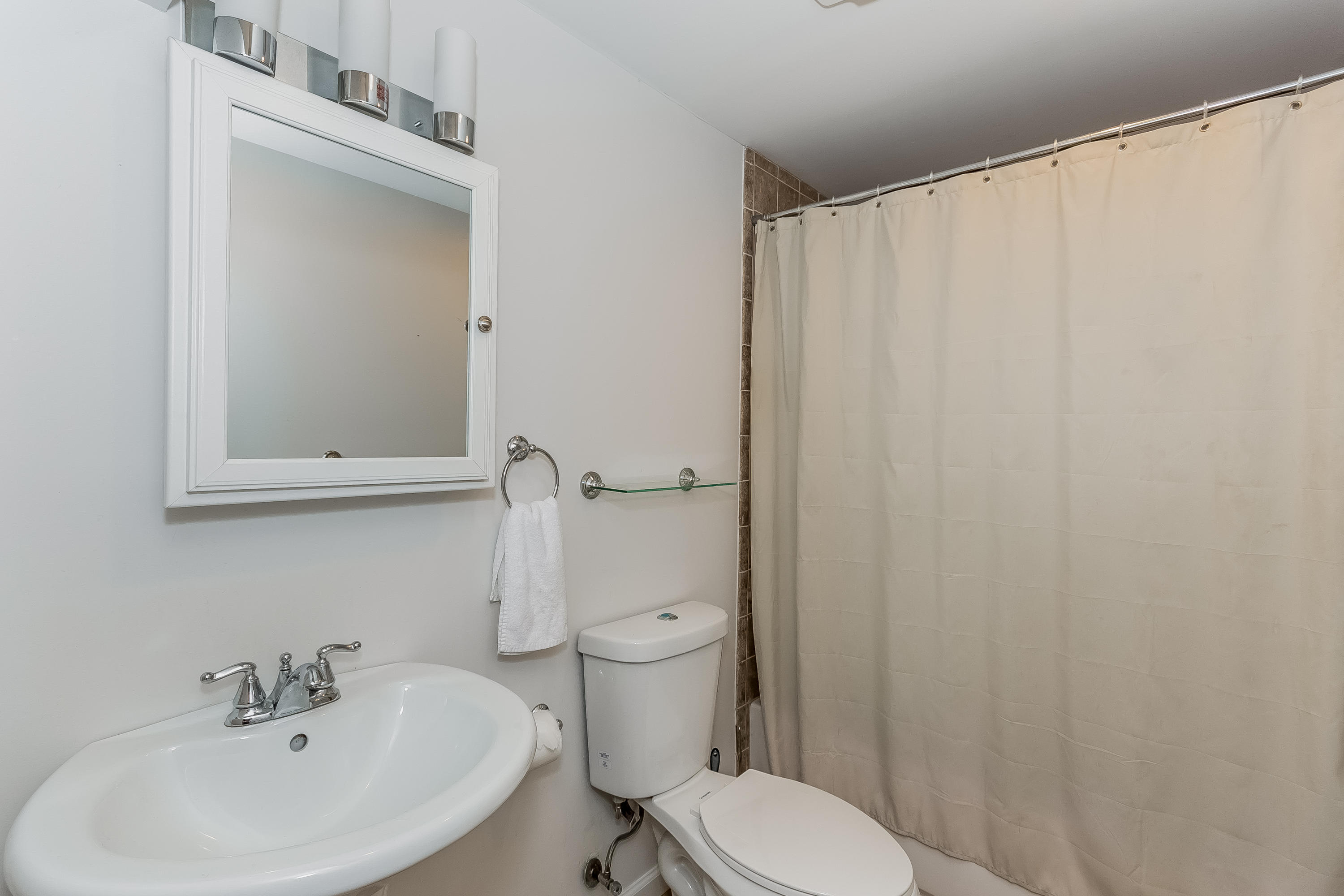 17 Bayberry Hill Road Ridgefield, CT 06877 - Photo 41 of 50 a white toilet sitting next to a white sink