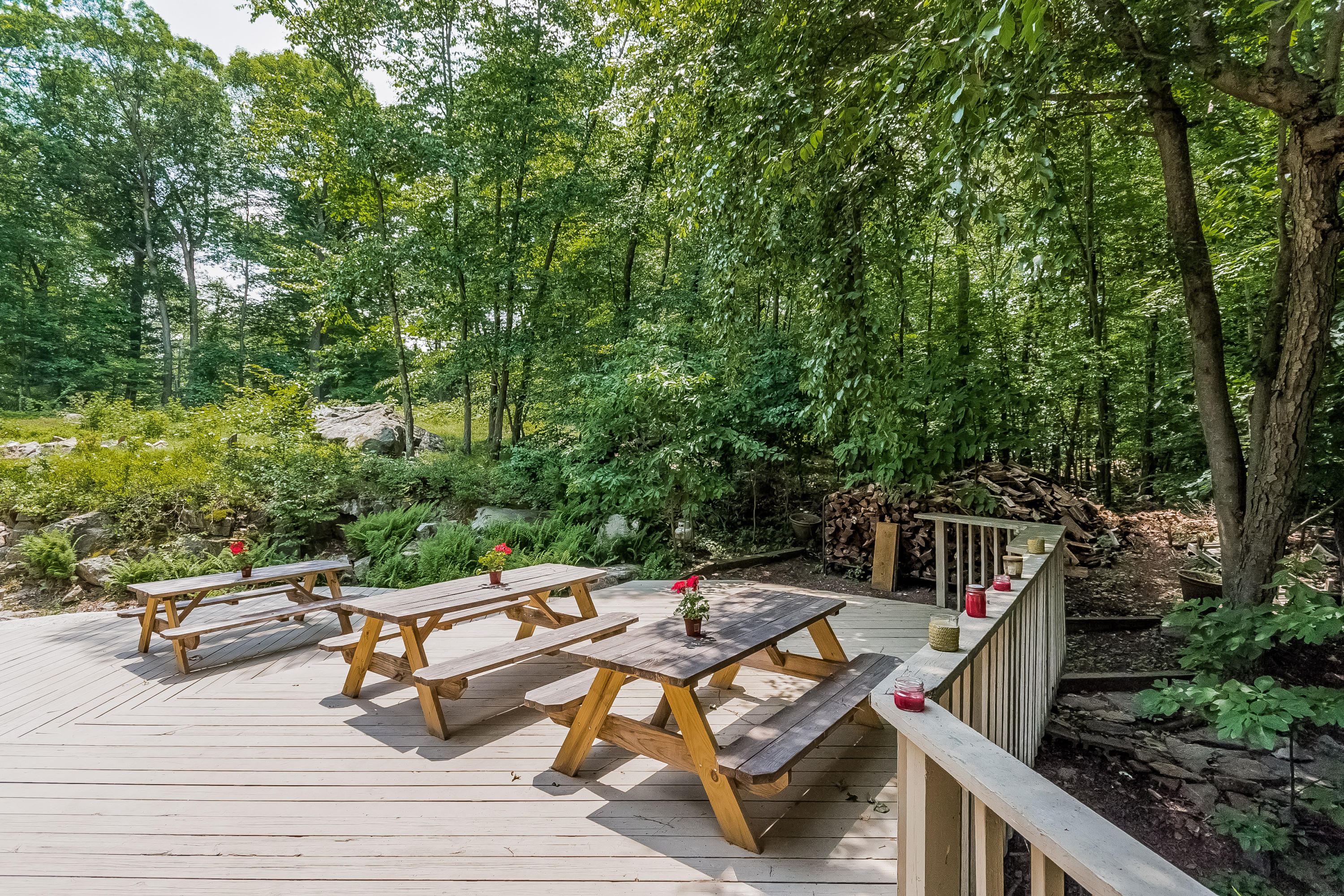 17 Bayberry Hill Road Ridgefield, CT 06877 - Photo 43 of 50 a roof deck with table and chairs under an umbrella