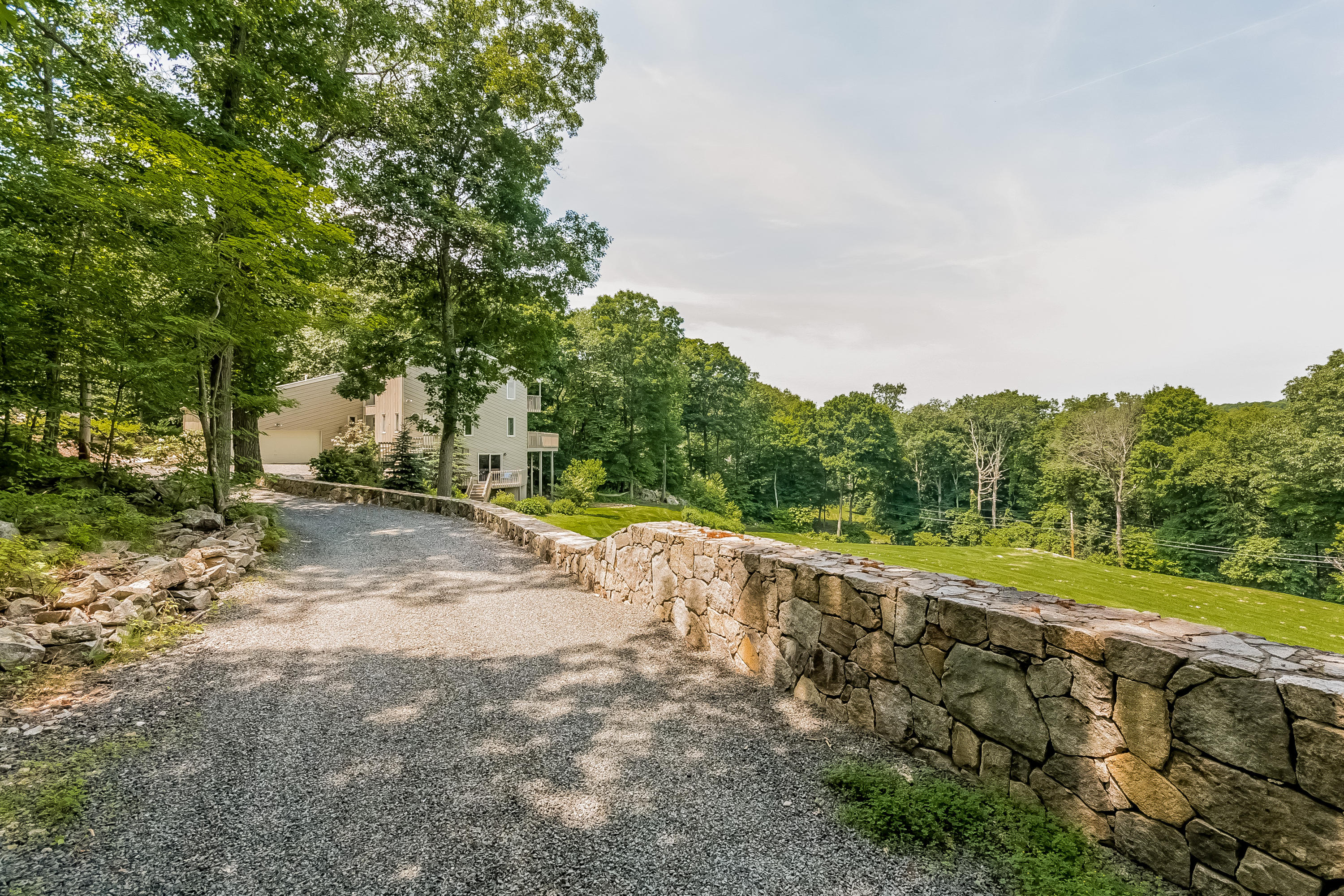 17 Bayberry Hill Road Ridgefield, CT 06877 - Photo 50 of 50 a view of a road with a yard