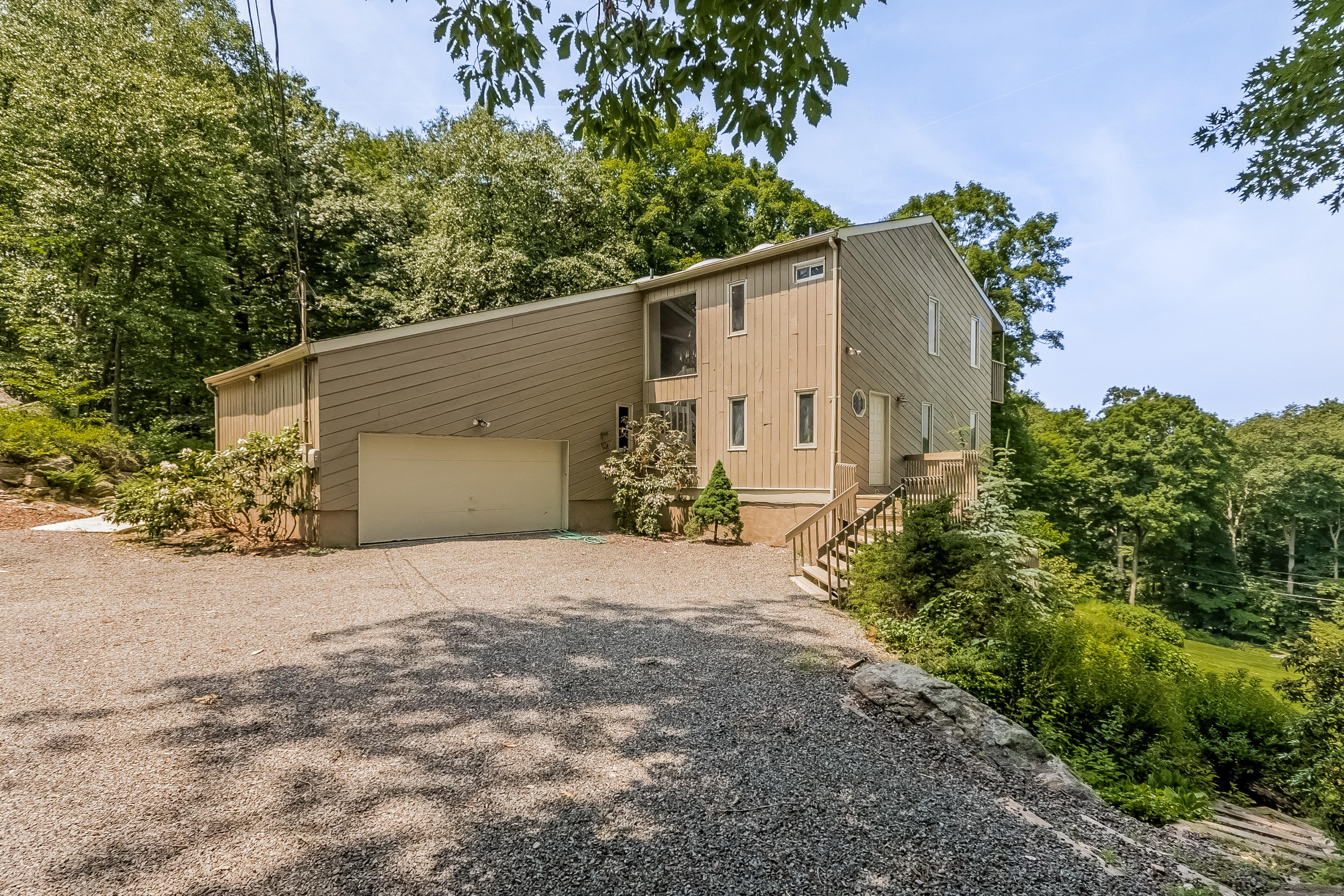 17 Bayberry Hill Road Ridgefield, CT 06877 - Photo 5 of 50 a view of a house with a yard and tree