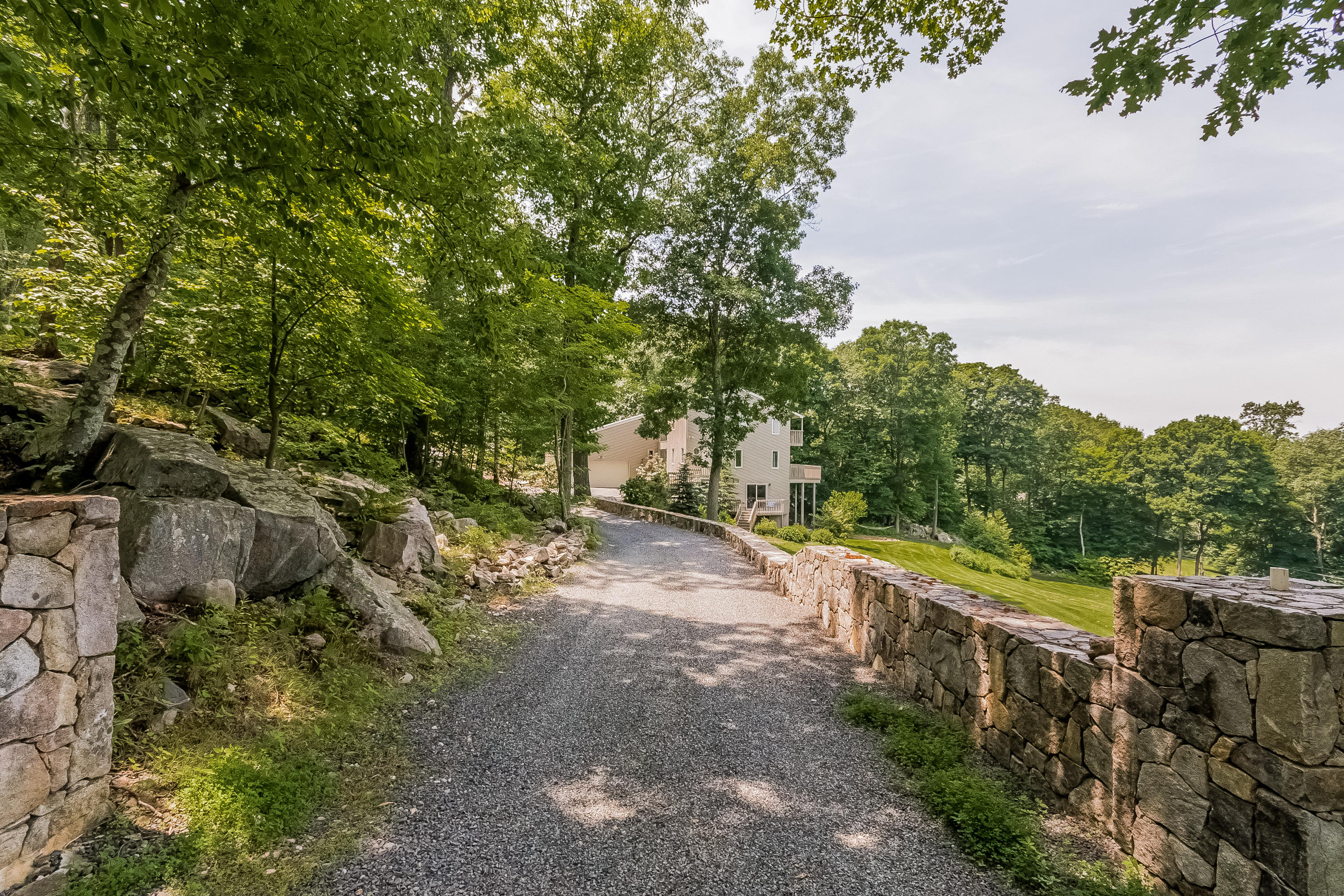 17 Bayberry Hill Road Ridgefield, CT 06877 - Photo 7 of 50 a view of a road with a yard