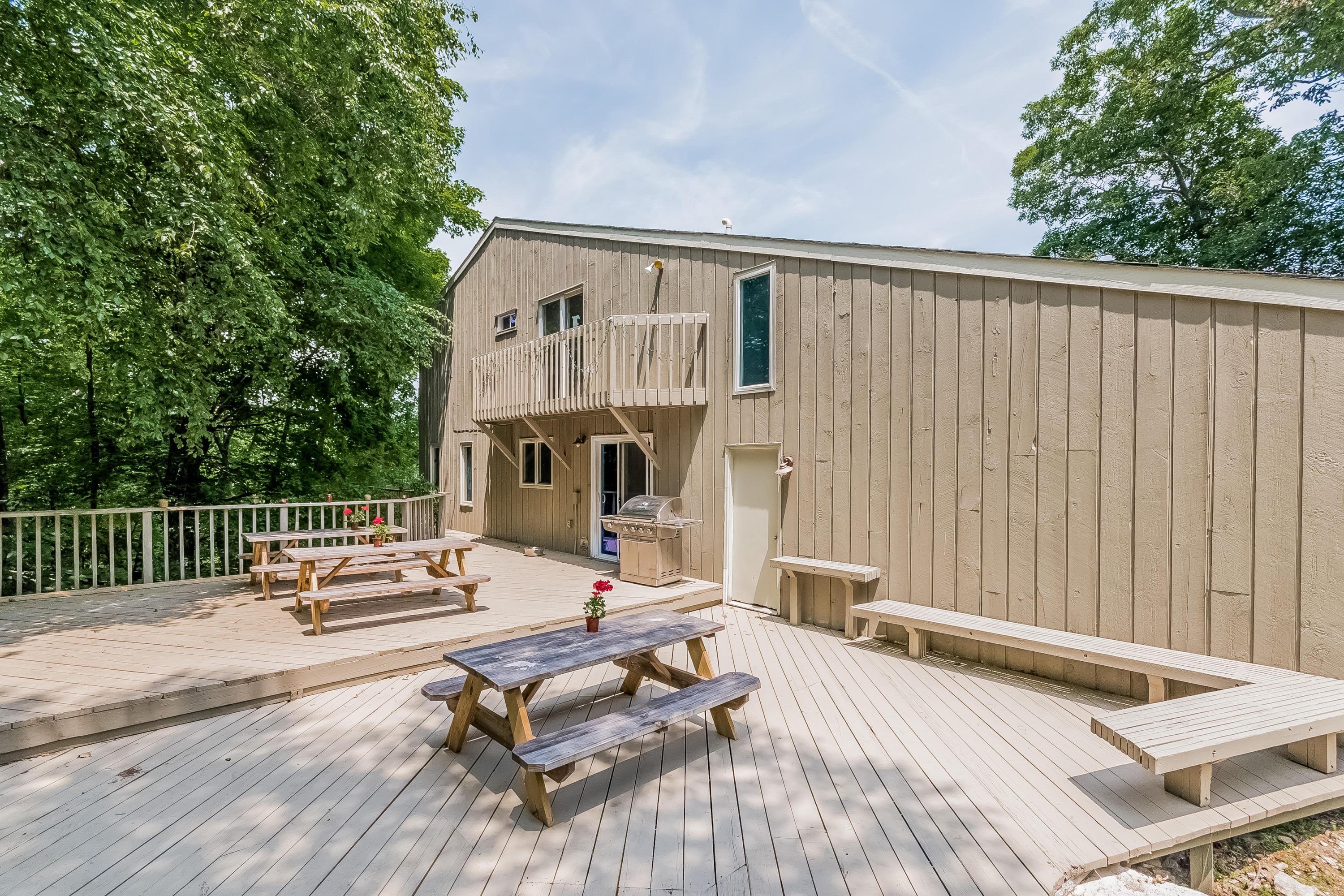 17 Bayberry Hill Road Ridgefield, CT 06877 - Photo 9 of 50 a view of a patio with a dining table and chairs with wooden floor
