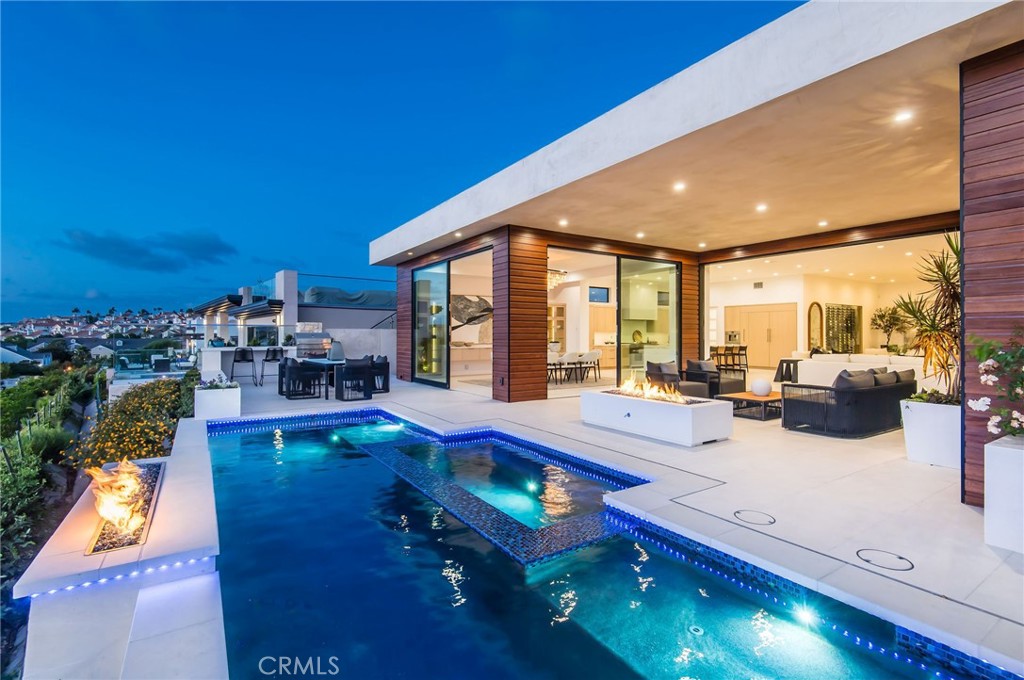11 Seabreeze Terrace Dana Point, CA 92629 - Photo 1 of 46 a living room with furniture pool table and garden view