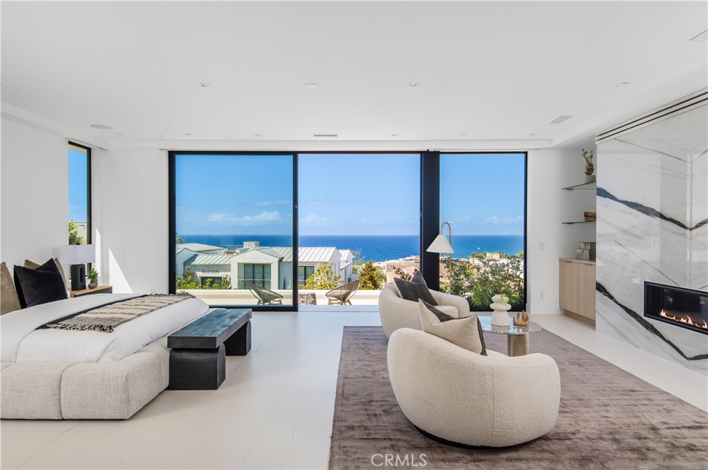 11 Seabreeze Terrace Dana Point, CA 92629 - Photo 15 of 46 a living room with furniture fireplace and a flat screen tv