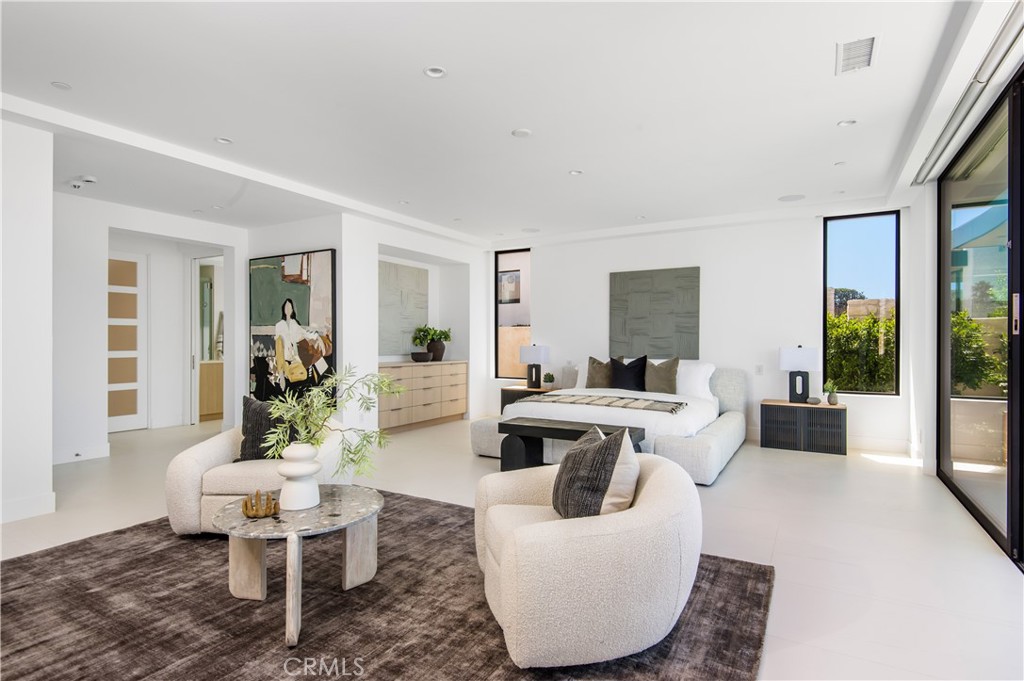 11 Seabreeze Terrace Dana Point, CA 92629 - Photo 16 of 46 a living room with couches chairs and a dining table with wooden floor