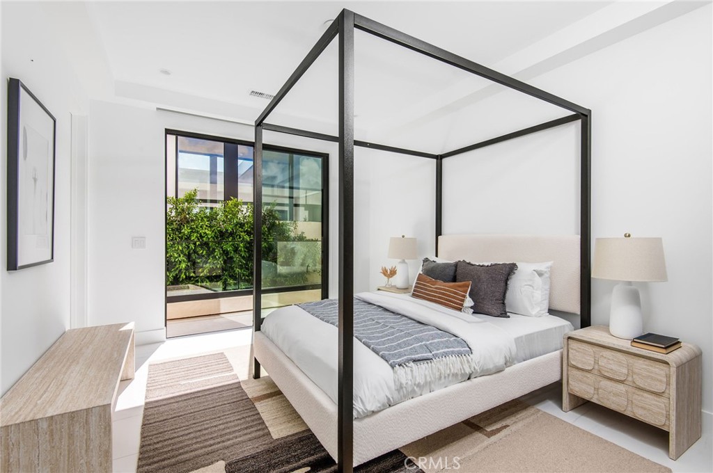 11 Seabreeze Terrace Dana Point, CA 92629 - Photo 20 of 46 a bedroom with a bed and large window