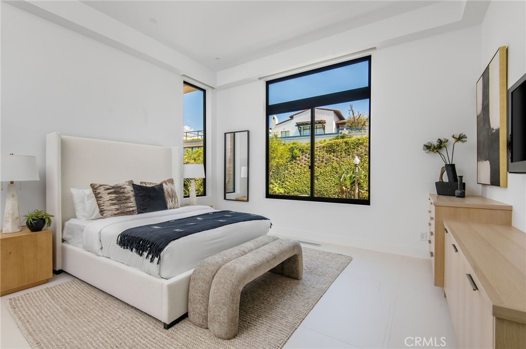 11 Seabreeze Terrace Dana Point, CA 92629 - Photo 24 of 46 a bed room with a bed and a large window