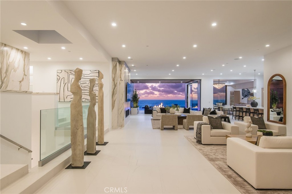 11 Seabreeze Terrace Dana Point, CA 92629 - Photo 3 of 46 a living room with fireplace furniture and a flat screen tv