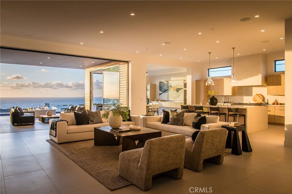 11 Seabreeze Terrace Dana Point, CA 92629 - Photo 36 of 46 a living room with fireplace furniture and a large window