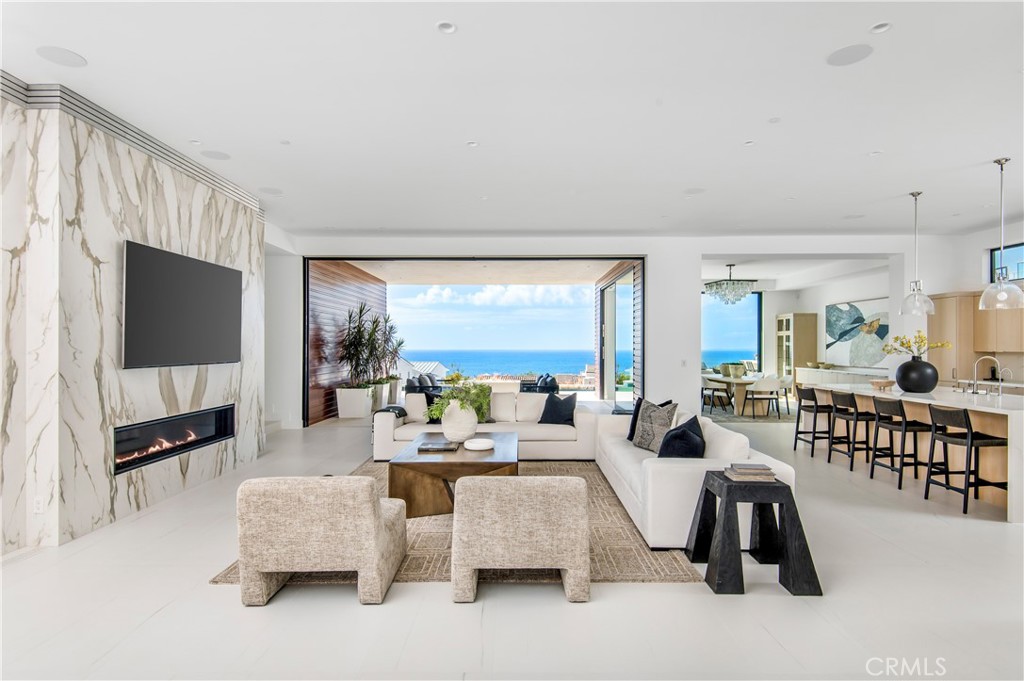 11 Seabreeze Terrace Dana Point, CA 92629 - Photo 7 of 46 a living room with furniture and a flat screen tv
