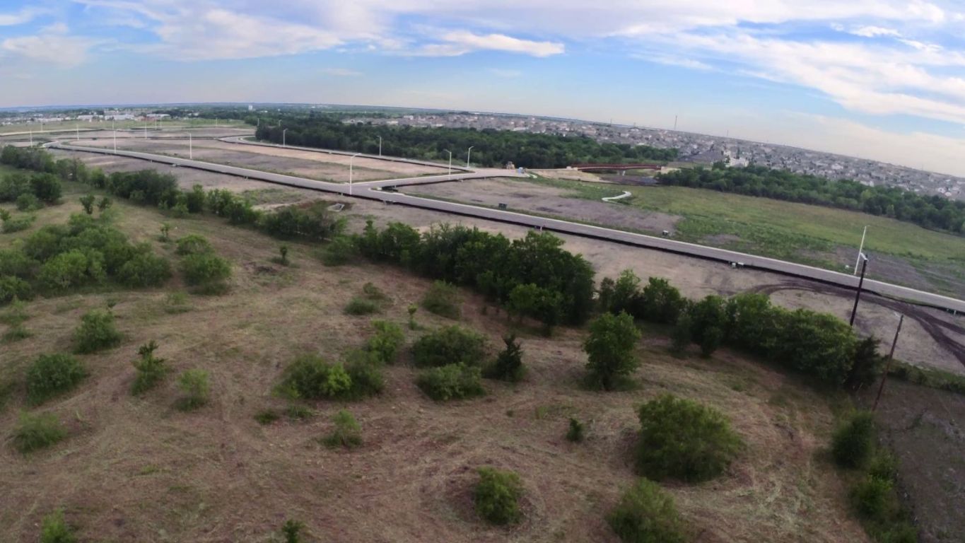 13706 1/2 Bois-D-Arc Road Manor, TX 78653 - Photo 10 of 11 a view of a yard with wooden fence