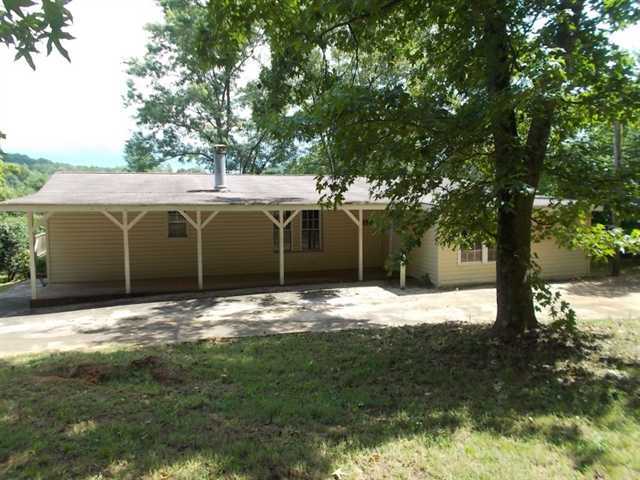 7975 Nicholson Road Cumming, GA 30028 - Photo 1 of 1 a view of a yard with large tree