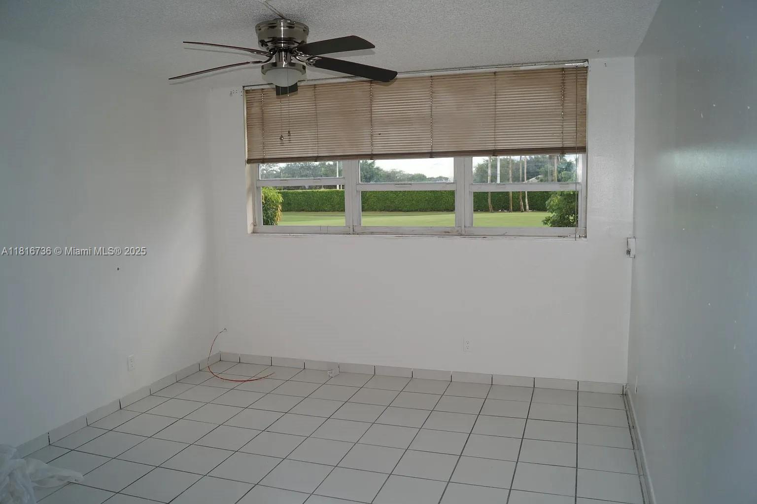 9820 South Hollybrook Lake Drive, Unit 205 Pembroke Pines, FL 33025 - Photo 2 of 4 an empty room with a window
