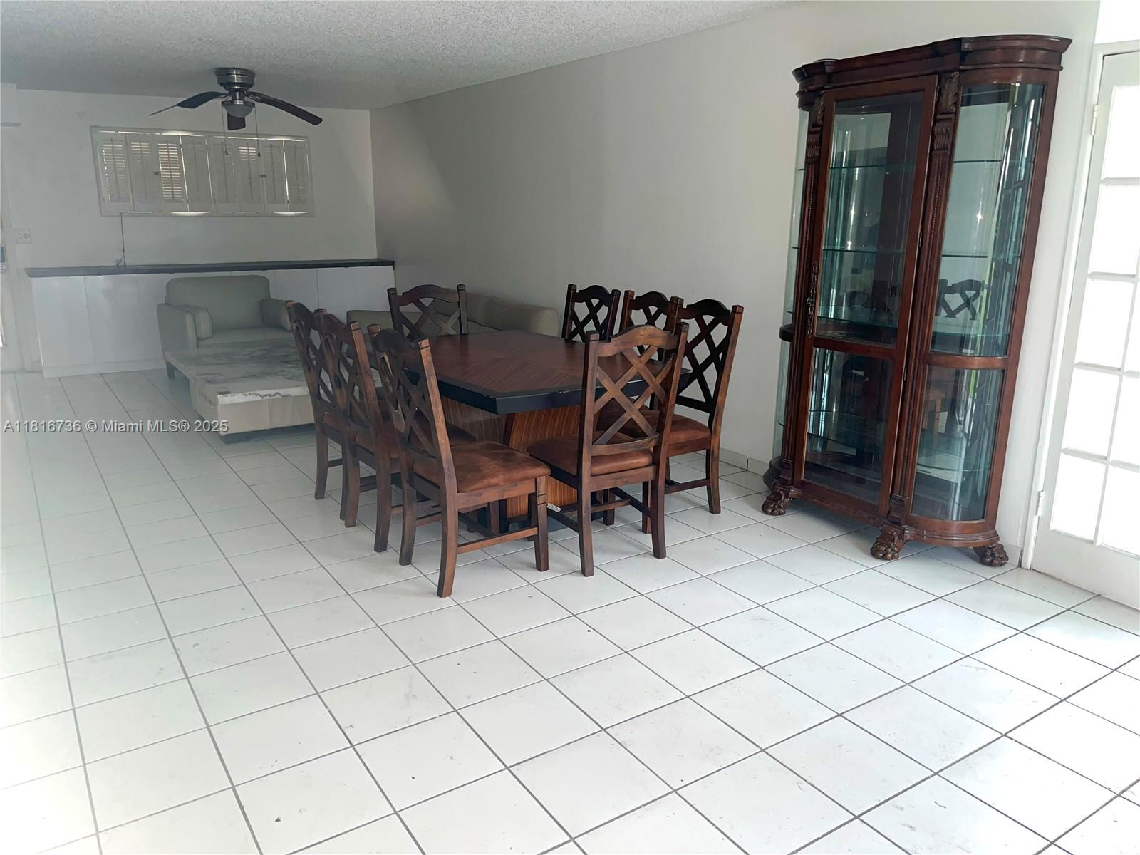9820 South Hollybrook Lake Drive, Unit 205 Pembroke Pines, FL 33025 - Photo 4 of 4 a view of a dining room with furniture
