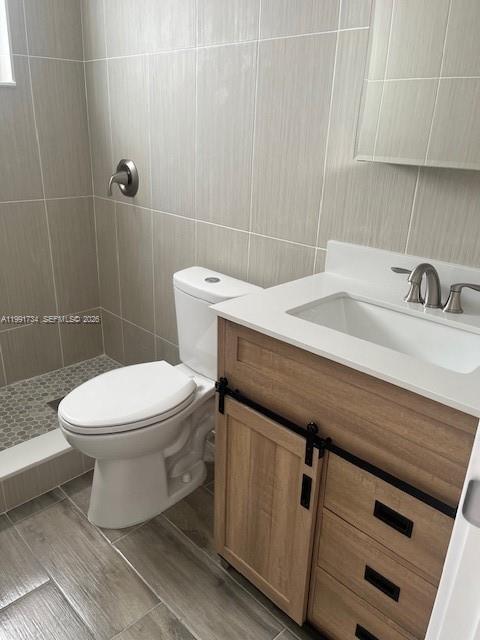 1151 West 28th Street, Unit 1 Hialeah, FL 33010 - Photo 12 of 25 a bathroom with a sink a toilet and a mirror
