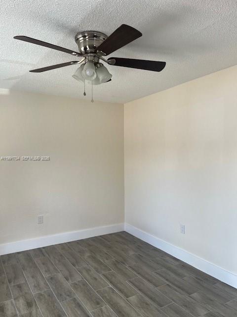 1151 West 28th Street, Unit 1 Hialeah, FL 33010 - Photo 20 of 25 a view of a room with wooden floor and ceiling fan