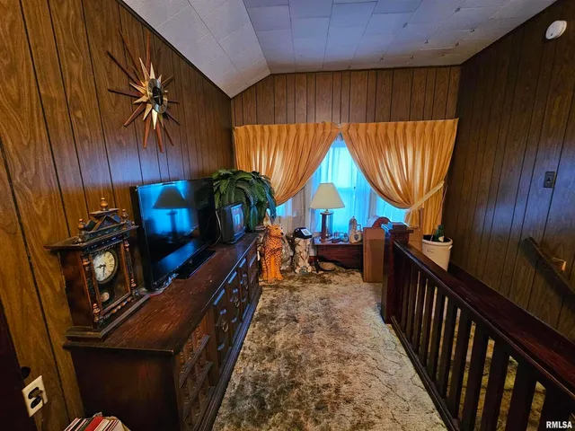 a view of a patio with table and chairs with wooden floor