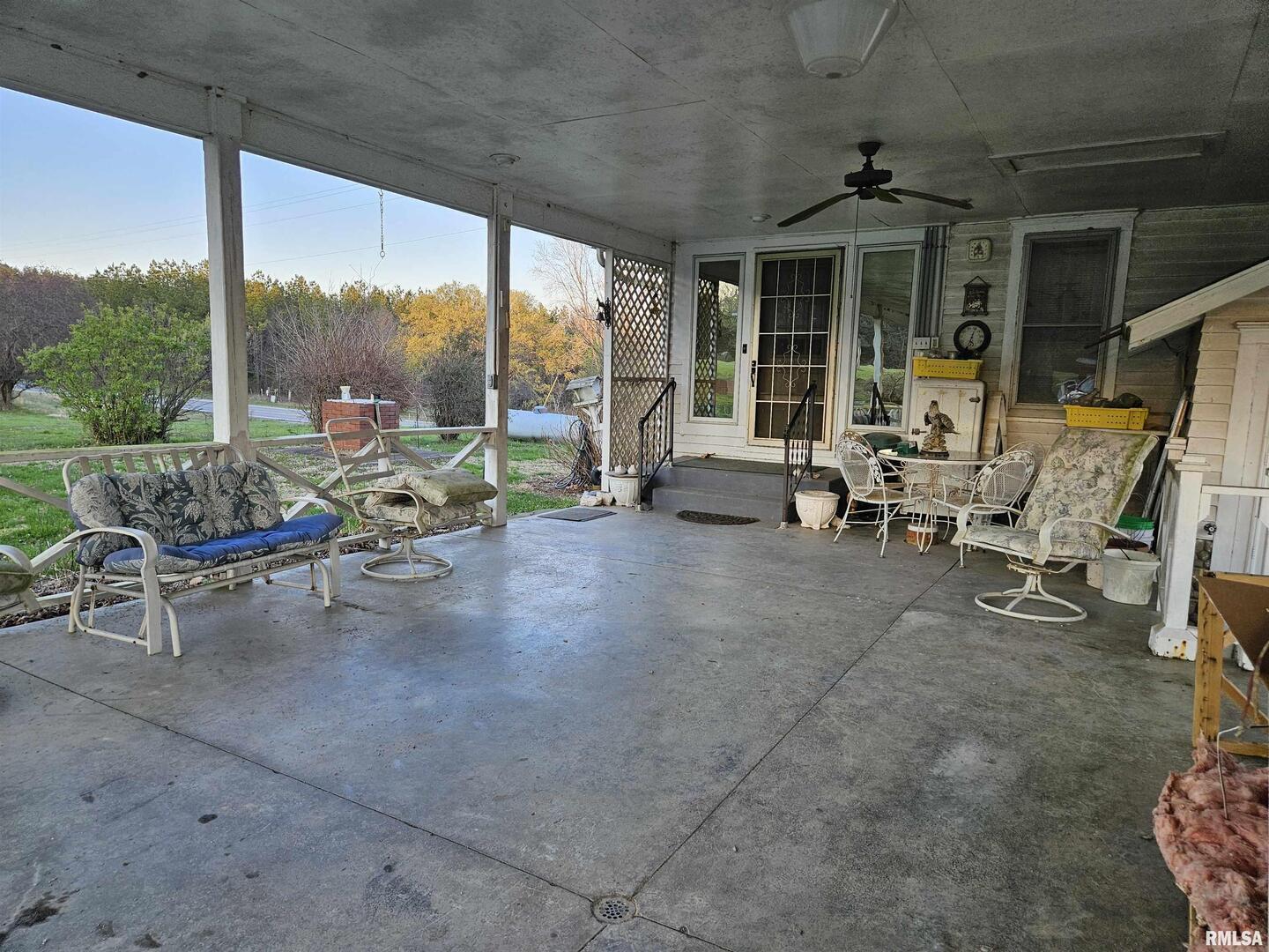 13675 Highway 45 New Burnside, IL 62967 - Photo 14 of 17 a view of a work space with furniture and floor to ceiling window