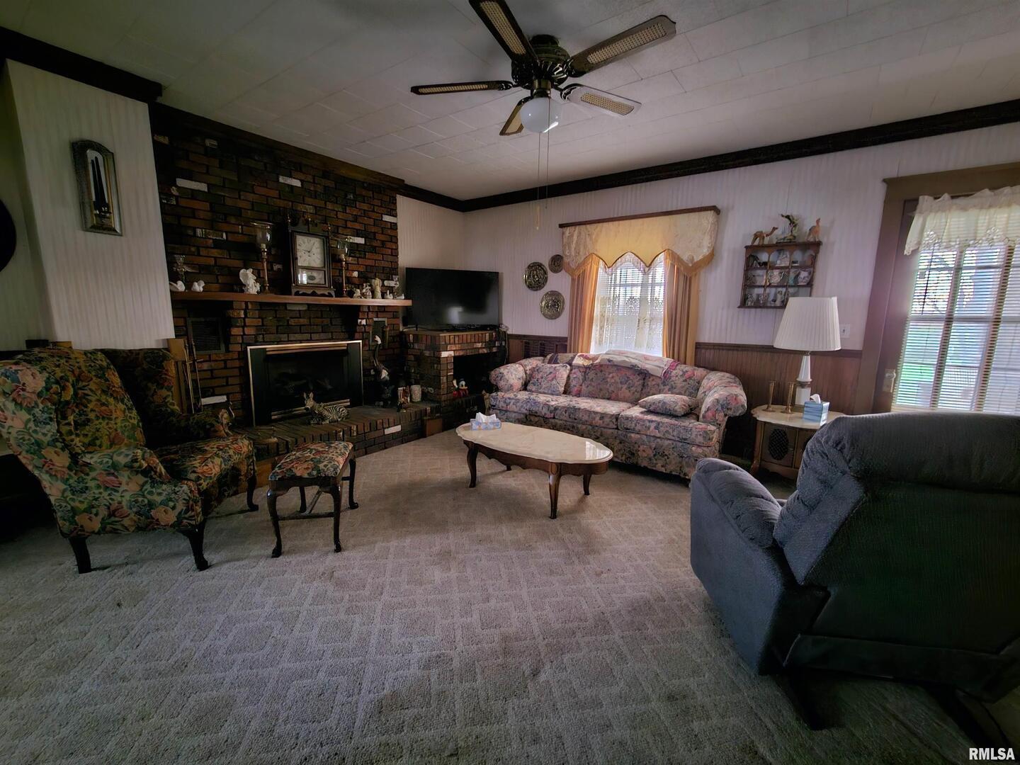 13675 Highway 45 New Burnside, IL 62967 - Photo 7 of 17 a living room with furniture a fireplace and a flat screen tv
