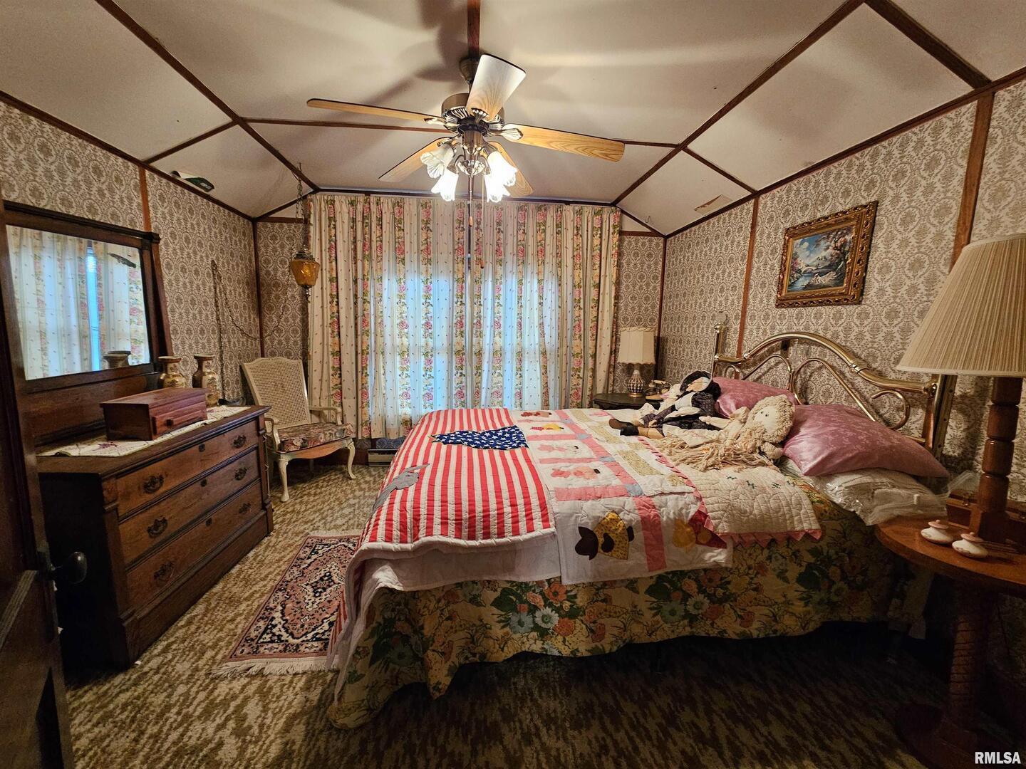 13675 Highway 45 New Burnside, IL 62967 - Photo 10 of 17 a bed sitting in a bedroom next to a window