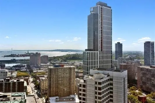 a view of balcony with seating space and city view