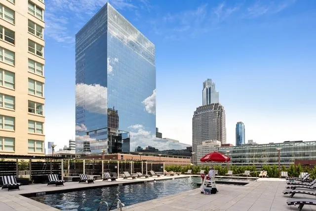 a view of a patio with couches chairs and a fire pit