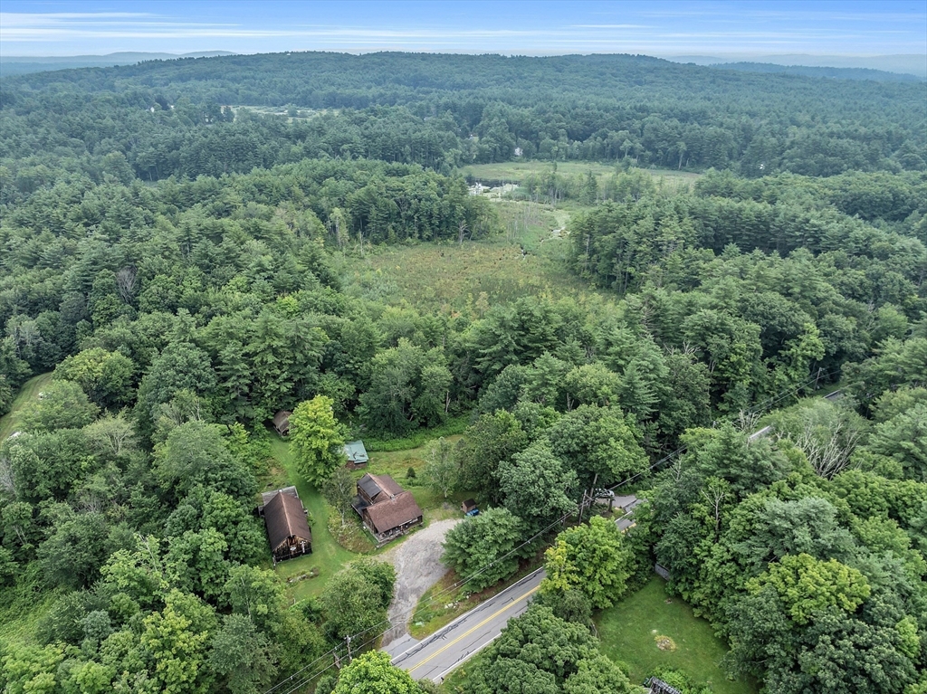147-155 South Road Pepperell, MA 01463 - Photo 15 of 25 a view of a lush green forest with trees and some houses
