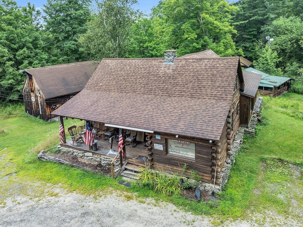 147-155 South Road Pepperell, MA 01463 - Photo 4 of 25 an aerial view of a house having patio with a yard