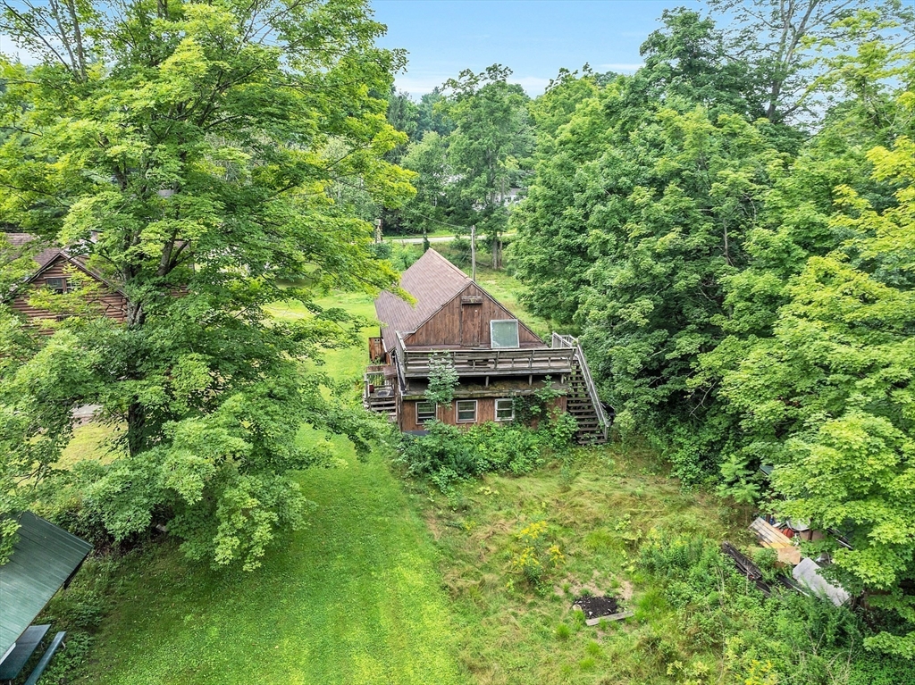 147-155 South Road Pepperell, MA 01463 - Photo 7 of 25 a house view with a garden space